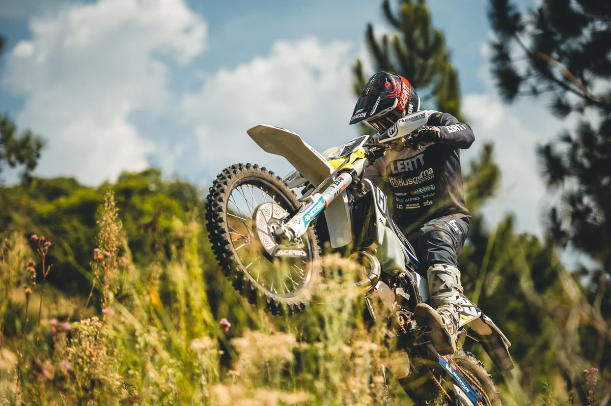 Travis Teasdale riding bike in full Leatt kit
